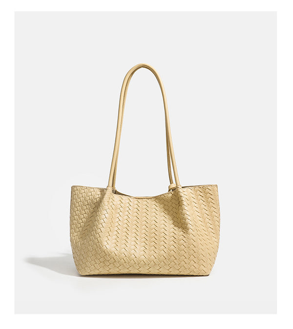 Woven leather-look tote bag in yellow with long shoulder straps, heart-shaped hanging charm, and removable inner zip pouch