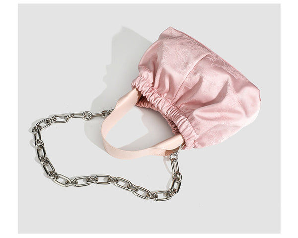 Small ruched satin-finish cloud bag with elasticized drawstring top, short top handle, and chunky silver-tone chain strap