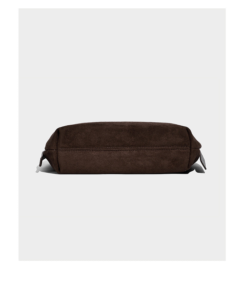 Slouchy crescent hobo shoulder bag in dark chocolate matte suede-look finish with adjustable strap and twin-pull top zip