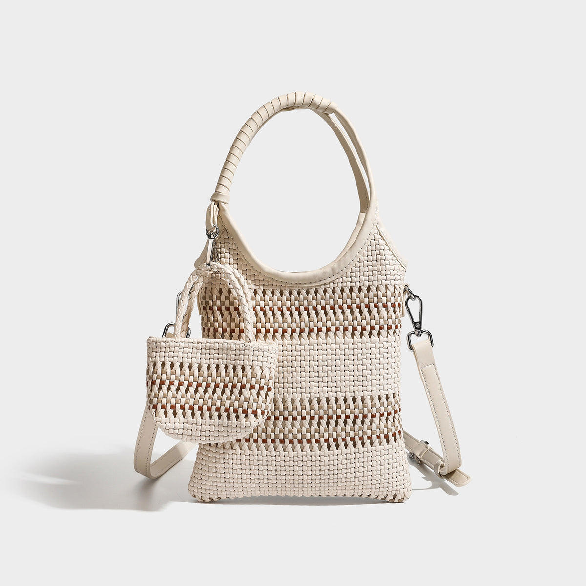 Color-block woven tote bag with rounded leather-look handles, detachable crossbody strap, and matching mini clip-on pouch in