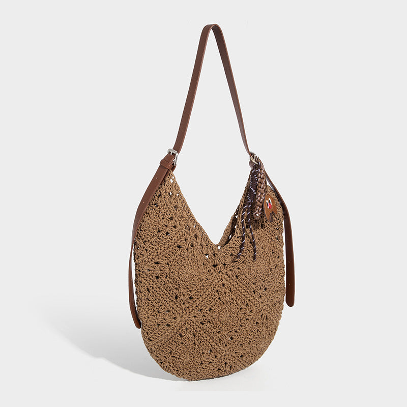 Slouchy wax-rope crochet hobo shoulder bag with leather-look adjustable strap and open lattice weave body, front view