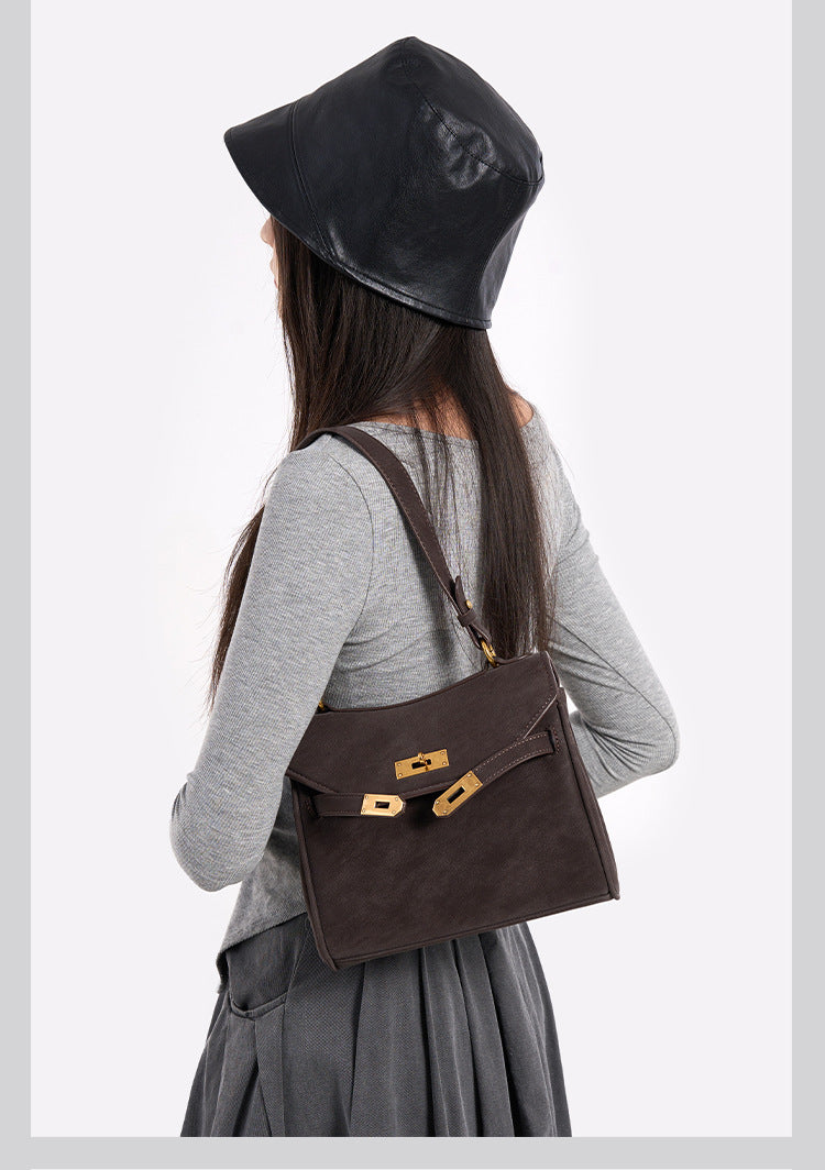 Structured dark brown flap satchel with gold-tone turn-lock hardware and detachable shoulder strap, detail view 9