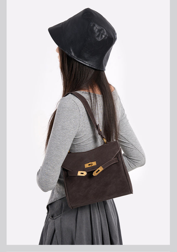 Structured dark brown flap satchel with gold-tone turn-lock hardware and detachable shoulder strap, detail view 9