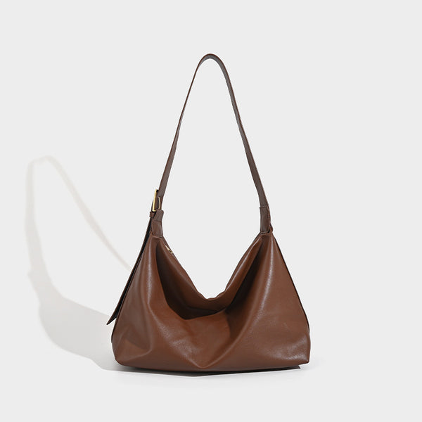 Large slouchy hobo shoulder bag in smooth black leather-look finish with gold-tone buckle hardware and adjustable strap