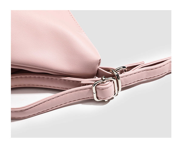 Glossy leather-look hobo shoulder bag with front bow lacing detail and silver-tone chain strap, detail view 11