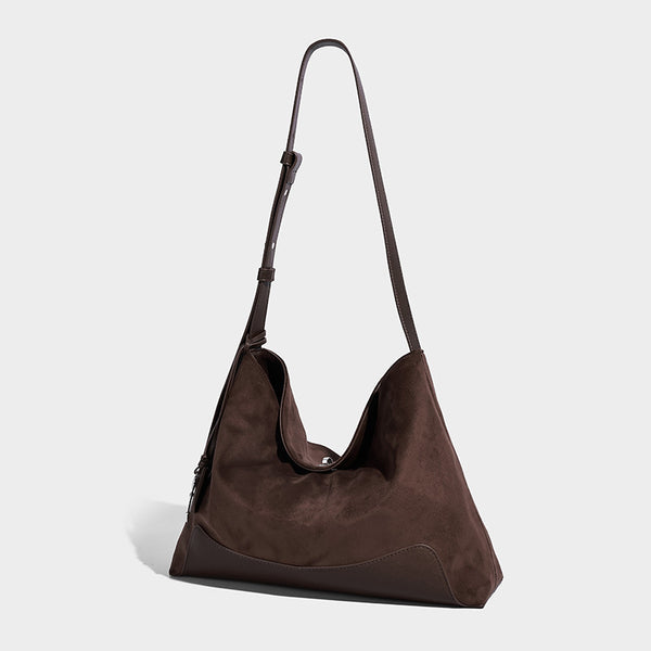 Dark brown slouchy hobo bag with matte suede-look body, smooth leather-look base trim, adjustable shoulder strap, and, front