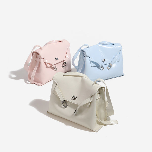 Structured rectangular flap shoulder bag in glossy leather-look finish with silver-tone turn-lock closure and adjustable