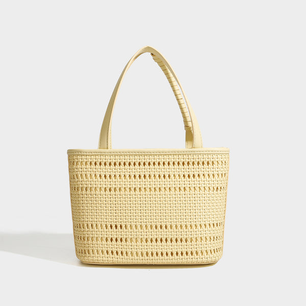 Structured open-weave tote bag with smooth leather-look trim, double top handles, detachable crossbody strap, and mini zip