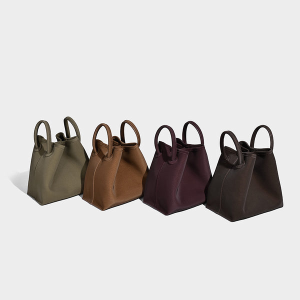 Small structured matte pebbled tote bag with twin top handles and removable zip pouch, detail view 2