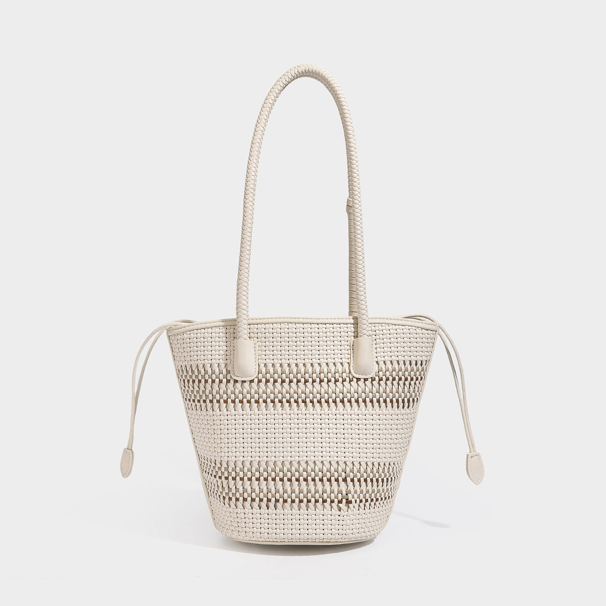 Structured woven bucket tote bag in pastel blue with braided shoulder strap, open lattice weave body, cream drawstring