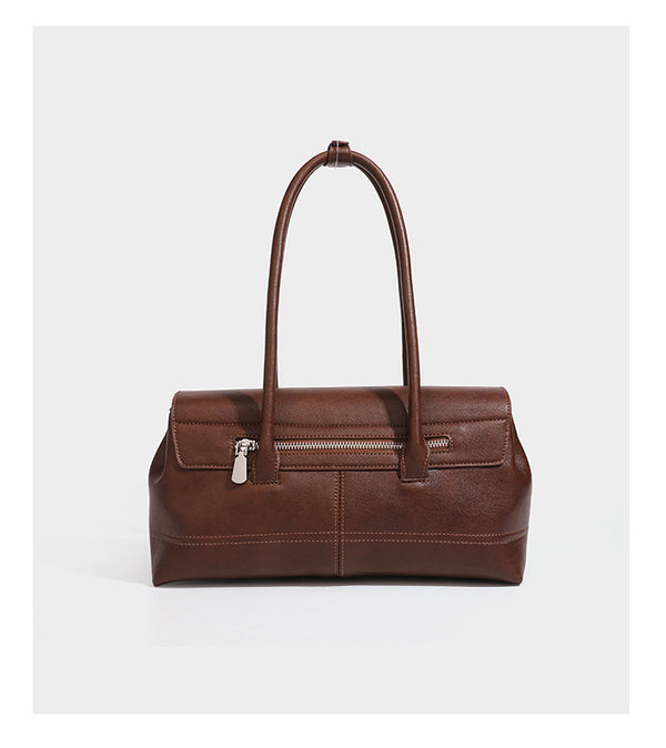 Structured rectangular satchel bag with dual rounded top handles and central metal turn-lock flap closure, detail view 10