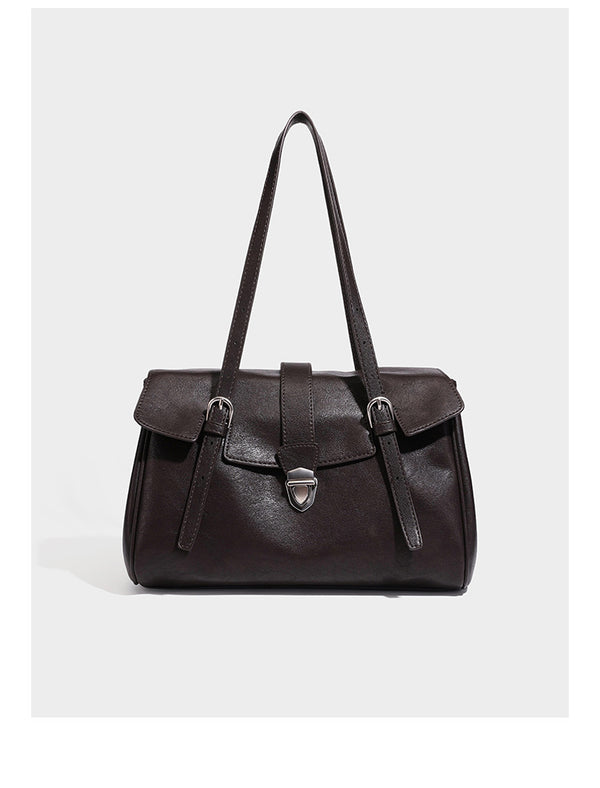 Large structured vintage-style tote bag with flap-front turn-lock closure, twin buckle straps, and double shoulder handles