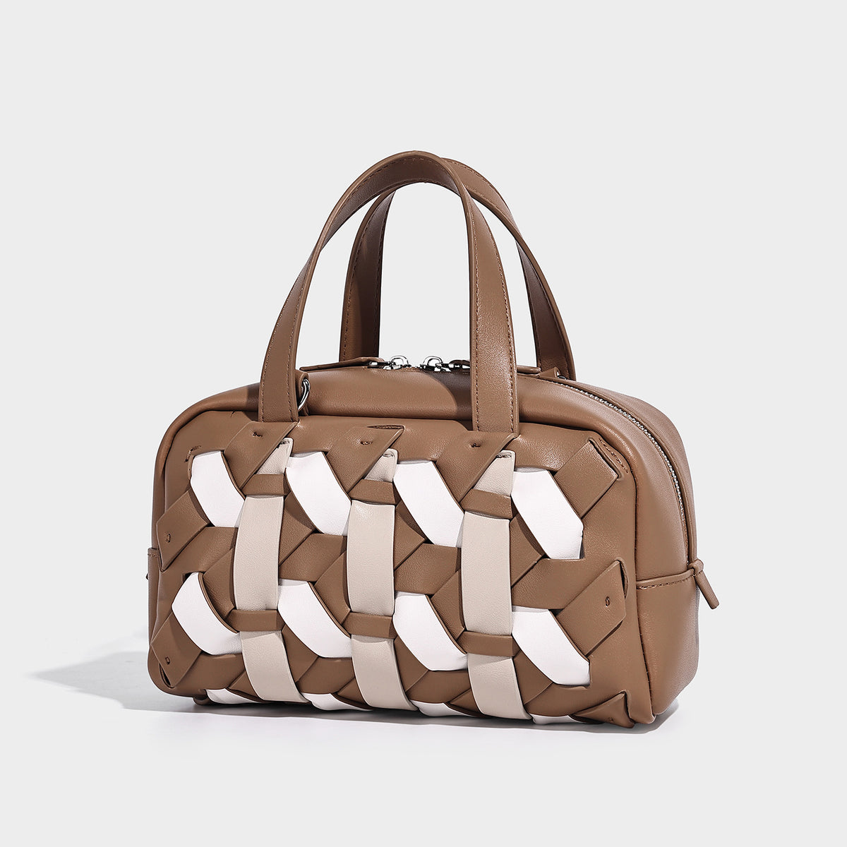 Small structured satchel bag with two-tone woven front panel, dual top handles, and detachable crossbody strap in tan brown