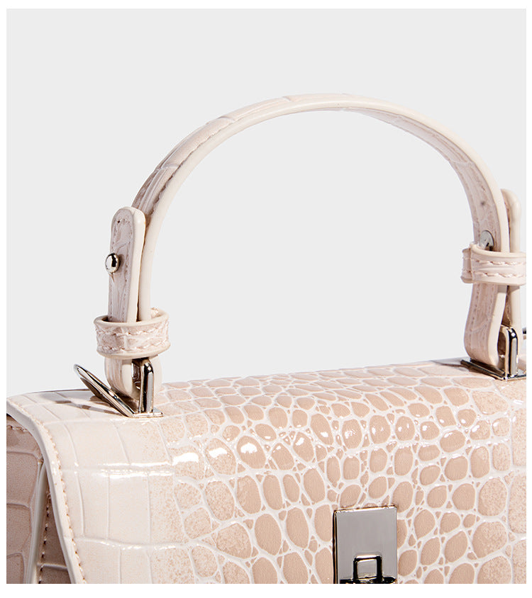 Small structured crocodile-embossed glossy top-handle satchel bag with silver-tone turn-lock clasp and detachable shoulder