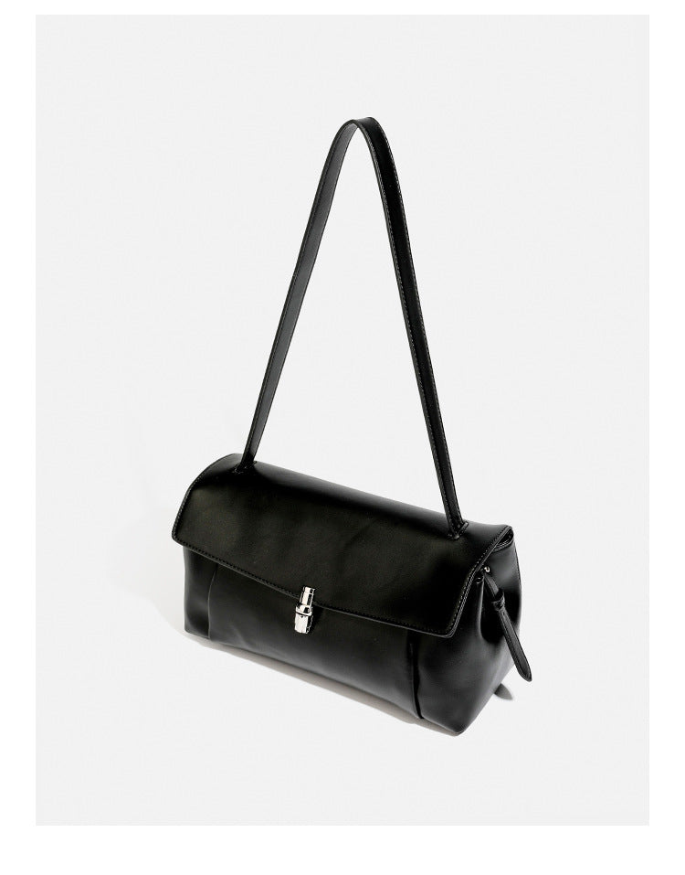 Structured rectangular flap shoulder bag with smooth leather-look finish, silver-tone turn-lock clasp, and long slim