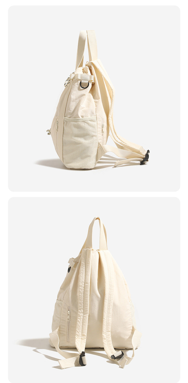 Soft matte drawstring backpack tote with braided cord closure, front zip pocket, and mesh side panels, detail view 9