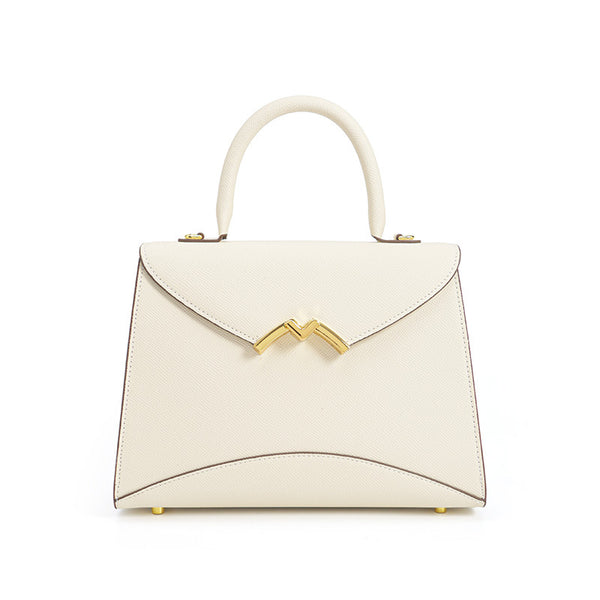 Structured trapezoid top-handle satchel in golden brown cross-grain textured finish with gold M-shaped clasp hardware and