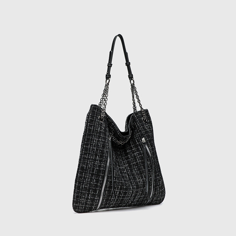 Große schwarze Schulter-Tote-Bag mit Tweedstruktur, silberfarbenem Kettenriemen und Trägern in Lederoptik, Metallösen und Außenreißverschluss