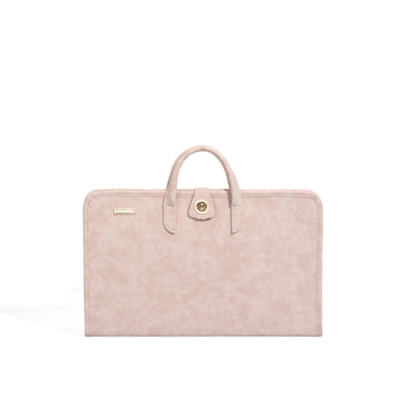 Blush pink structured flat tote bag with matte textured finish, dual top handles, and gold-tone twist clasp, detail view 5
