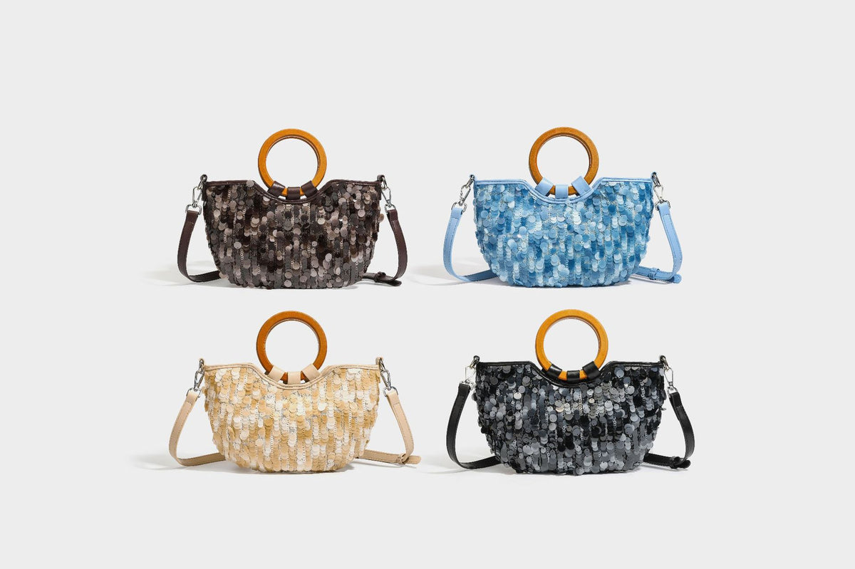 Small sequin half-moon handbag with circular wood-look ring handles and detachable leather-look shoulder strap, detail view