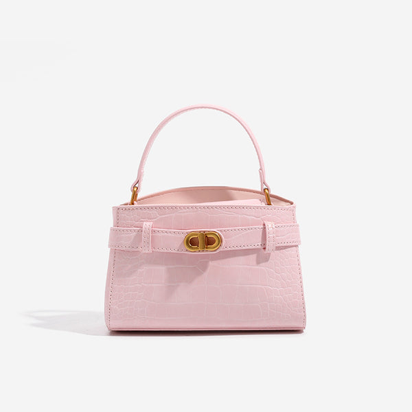 Small structured crocodile-embossed top-handle bag with gold-tone turn-lock closure and detachable shoulder strap, detail