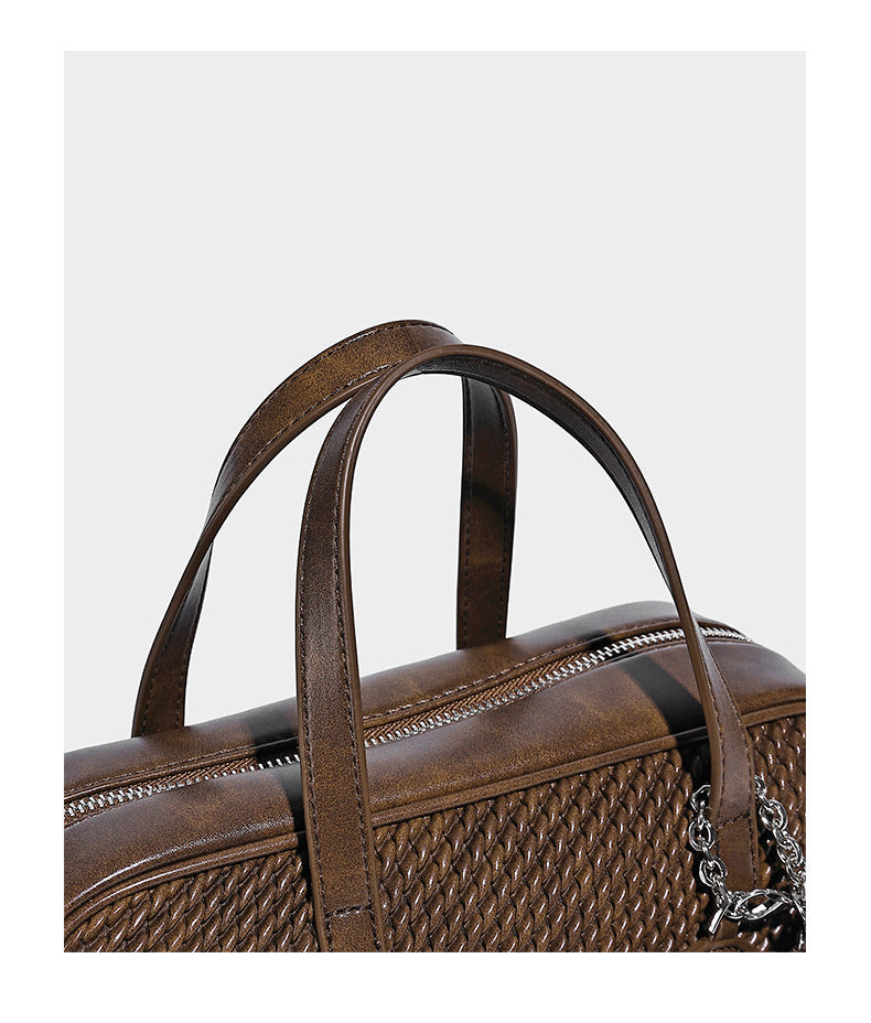 Structured woven-texture front top-handle handbag with zip closure, dual handles, detachable shoulder strap, and matching