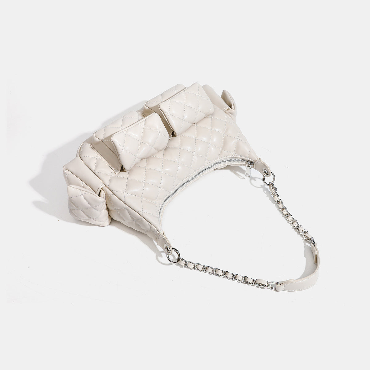 Off-white quilted leather-look hobo shoulder bag with diamond stitching, chain-and-strap handle, two front flap pockets