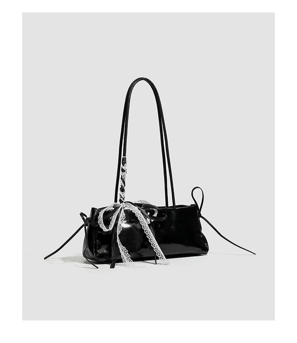 Compact glossy leather-look shoulder bag with lace bow and ribbon trim, detail view 11