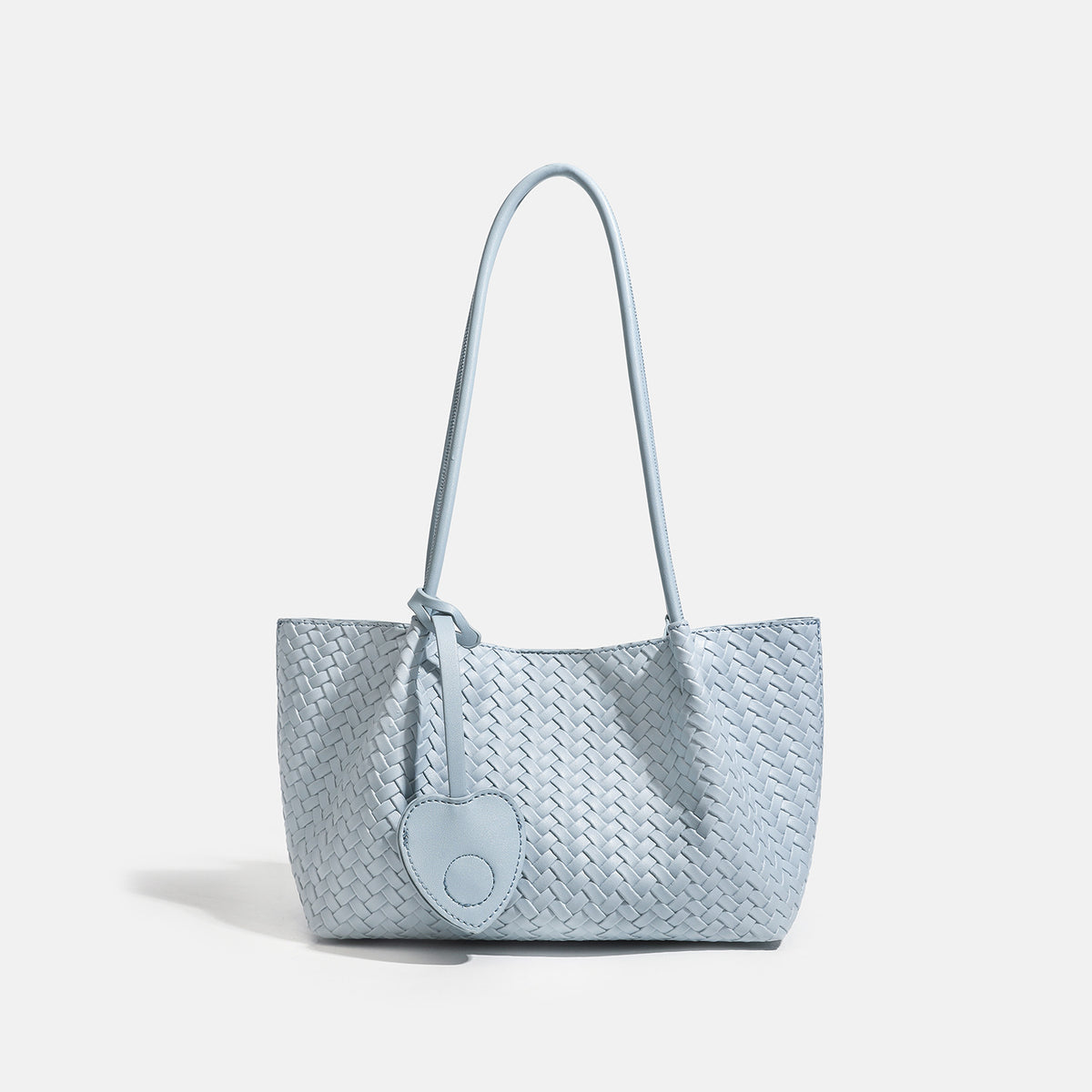 Woven leather-look tote bag in yellow with long shoulder straps, heart-shaped hanging charm, and removable inner zip pouch