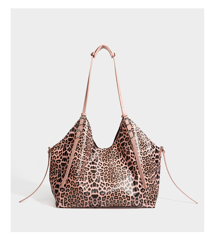 Large leopard print shoulder tote bag with glossy finish, long double straps, front zip pocket, silver-tone hardware, and