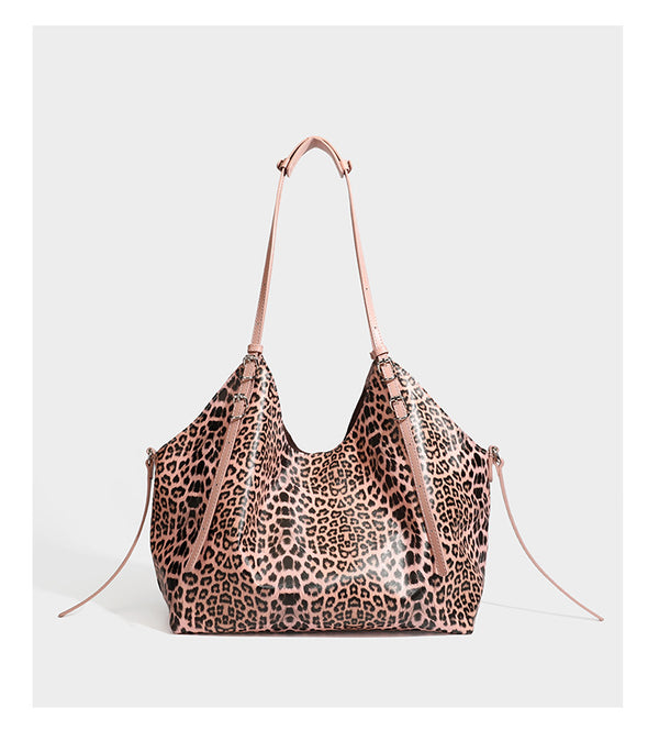 Large leopard print shoulder tote bag with glossy finish, long double straps, front zip pocket, silver-tone hardware, and