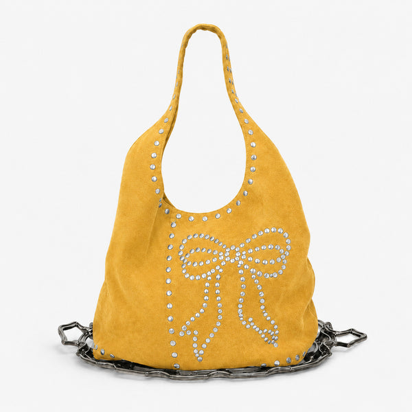 Oversize-Hobo-Schultertasche in schwarzer Velourslederoptik mit silberfarbenen Rundnieten und großem, mit Nieten besetztem Schleifenmotiv auf der Vorderseite, Detailansicht