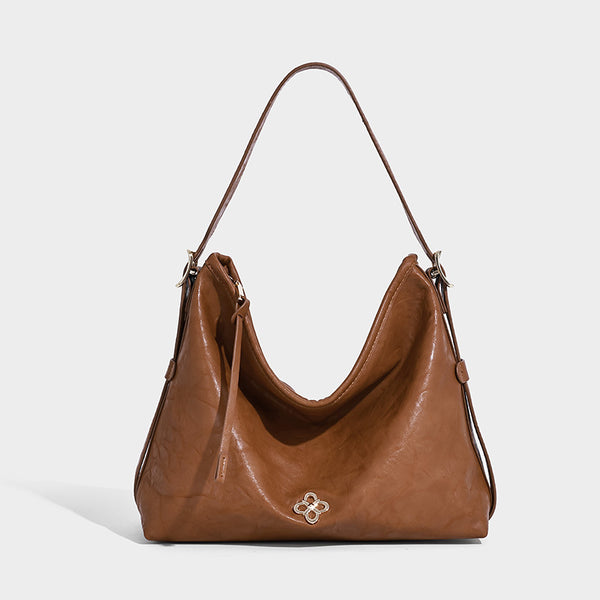 Slouchy leather-look hobo shoulder bag with gold-tone hardware and adjustable strap in brown, detail view 20
