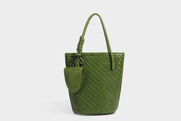 Structured woven-texture leather-look bucket bag in brown with knotted top handles, small front flap pouch, and adjustable