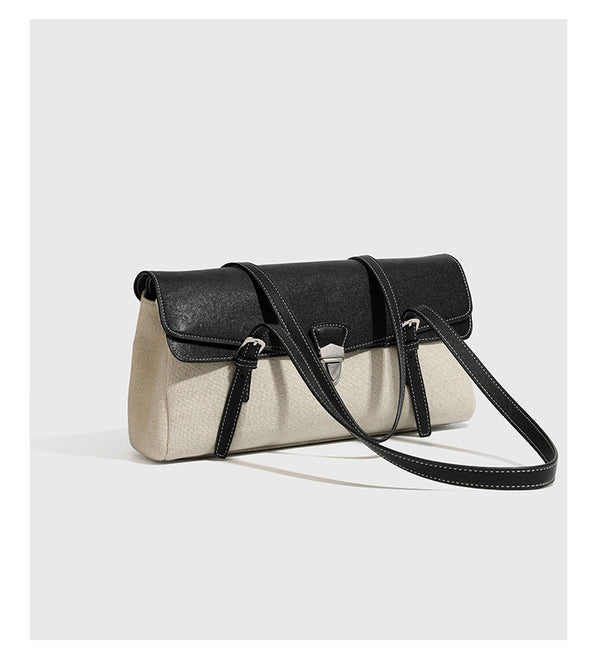 Strukturierte zweifarbige Schultertasche mit schwarzer Klappe in Lederoptik, cremefarbenem Korpus mit Webstruktur, silberfarbenem Drehverschluss und doppeltem