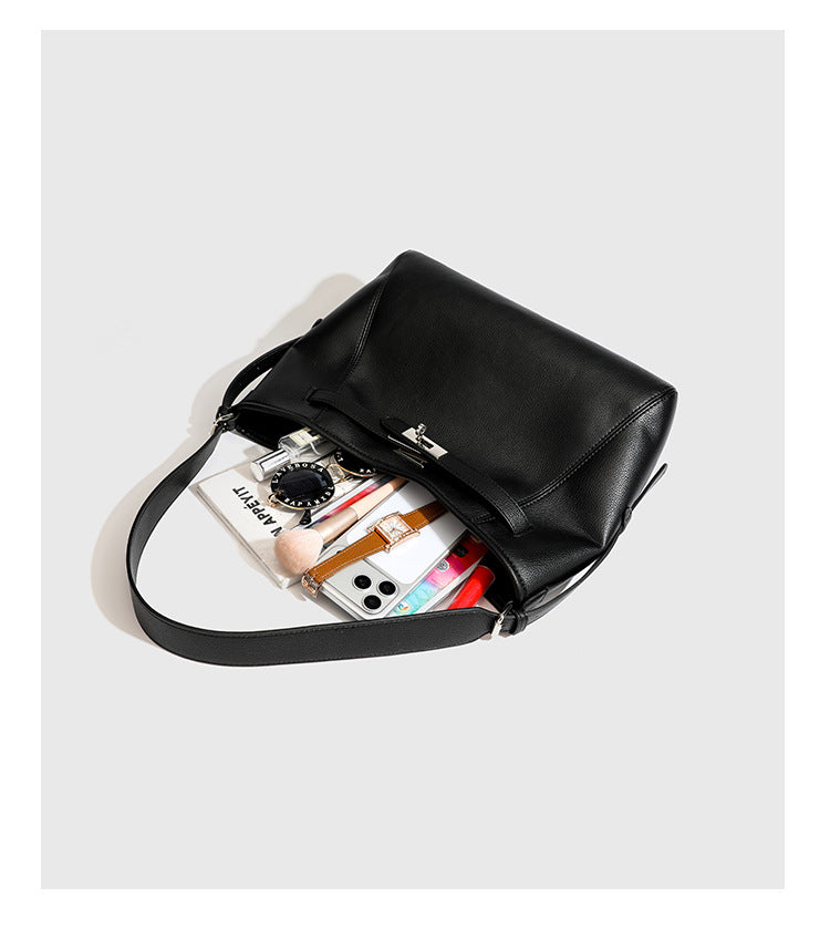 Large black pebbled leather-look hobo shoulder bag with silver-tone turn-lock front hardware and single flat adjustable