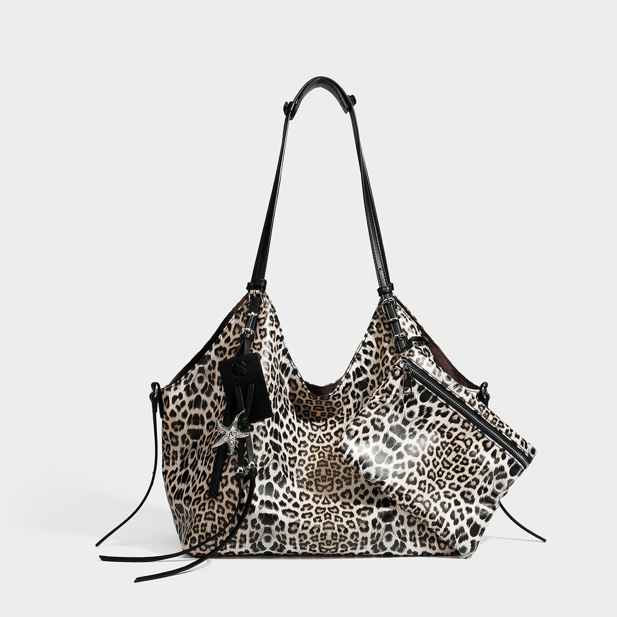 Large leopard print shoulder tote bag with glossy finish, long double straps, front zip pocket, silver-tone hardware, and