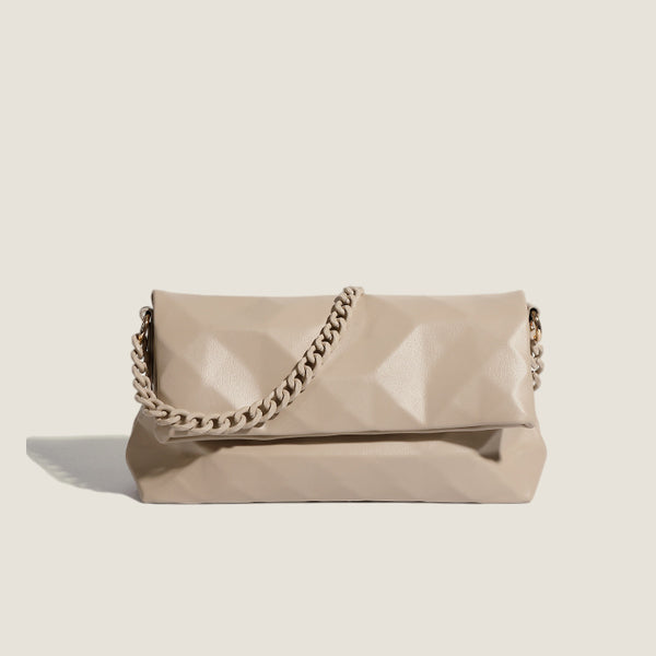 Cream white rectangular flap shoulder bag with geometric faceted surface and chunky tone-on-tone chain strap with gold-tone