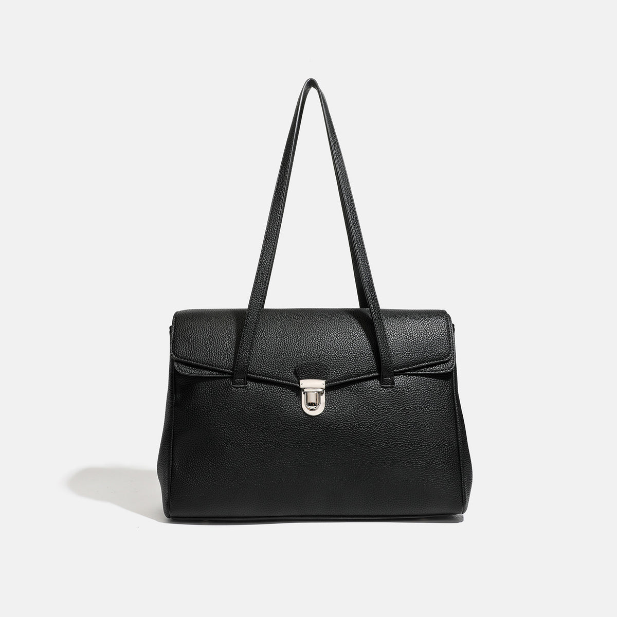 Structured black pebbled-finish flap tote bag with silver turn-lock clasp and long double shoulder straps, front view