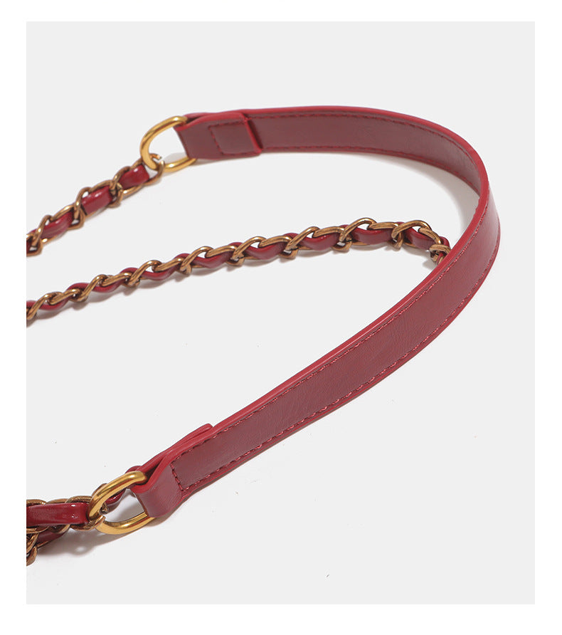 Structured glossy flap shoulder bag with antique gold floral turn-lock clasp and chain-and-leather strap, detail view 16
