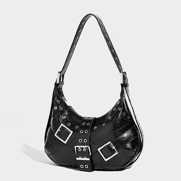 Glossy crescent hobo bag with silver-tone grommets, square buckle straps, and top zipper closure, front view