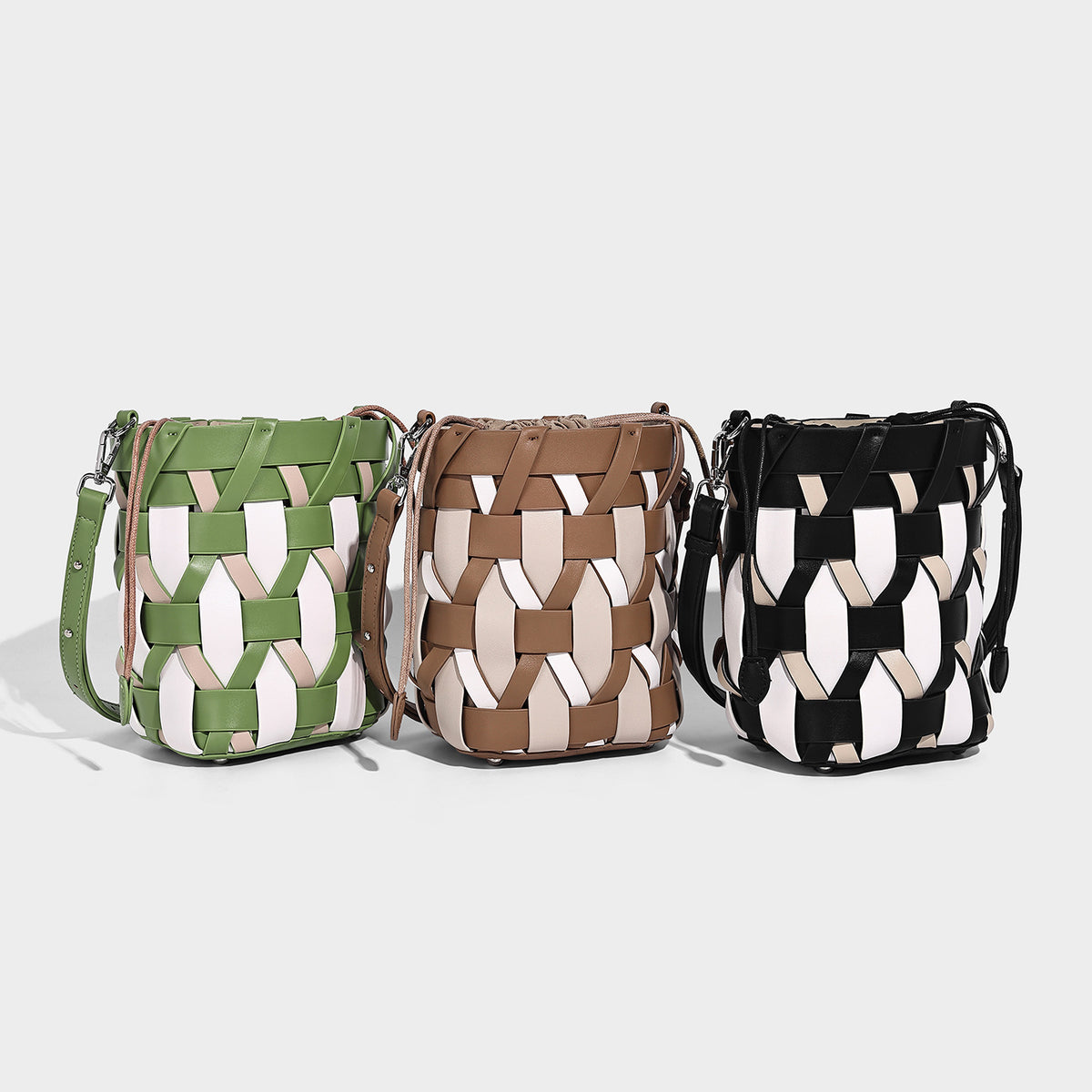 Small woven lattice bucket bag in tan and cream leather-look strips with drawstring top and detachable crossbody strap