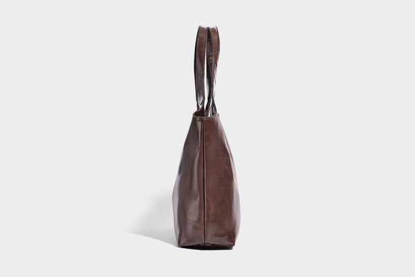 Glossy oil-wax leather-look open-top tote shoulder bag with embossed circular logo and long double straps, detail view 25