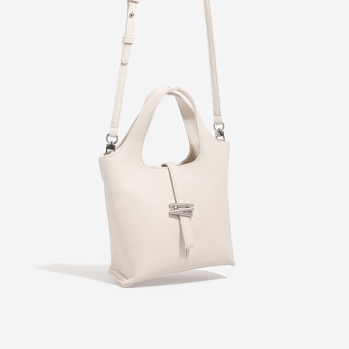Mini pebbled leather-look bucket tote with silver toggle clasp and dual top handles, detail view 3