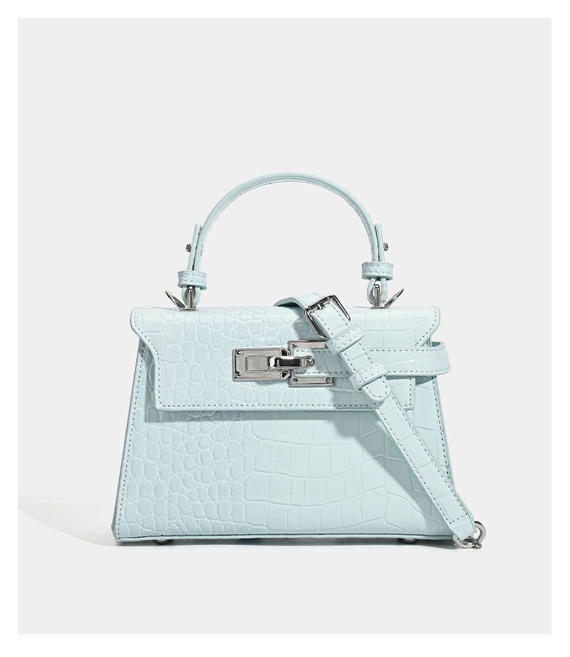 Croc-embossed mini top-handle satchel with silver turn-lock closure and adjustable crossbody strap, detail view 17