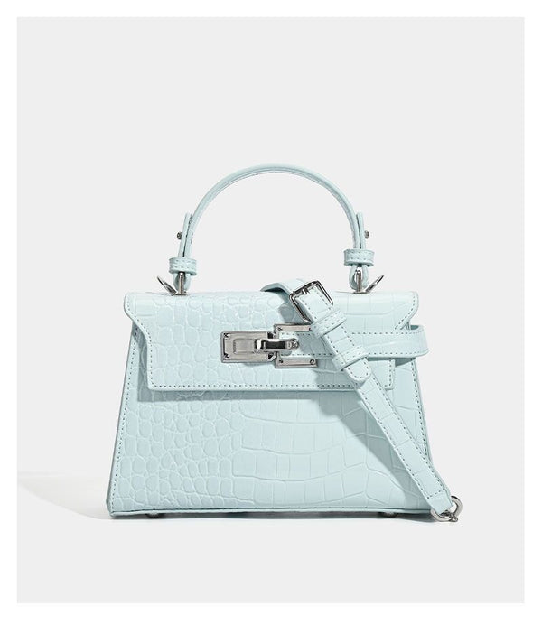 Croc-embossed mini top-handle satchel with silver turn-lock closure and adjustable crossbody strap, detail view 17