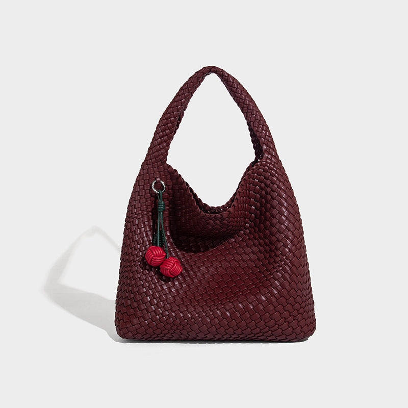 Soft hand-woven slouchy hobo tote bag with knotted tassel charm and single looped shoulder strap, detail view 15