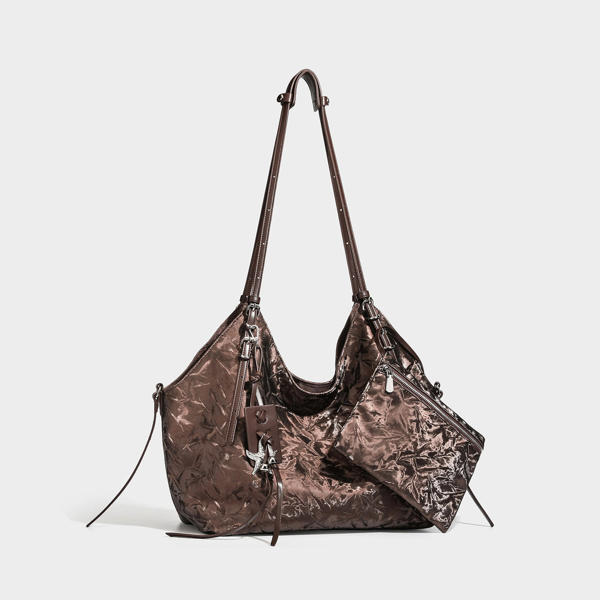 Slouchy crinkle-finish shoulder tote bag with silver hardware and attached zip pouch, front view