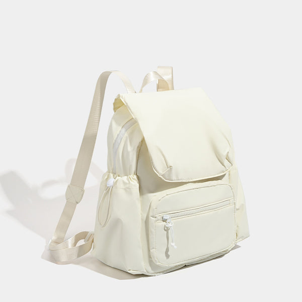 Soft matte nylon flap backpack with front zip pocket and side drawcord pockets, detail view 3