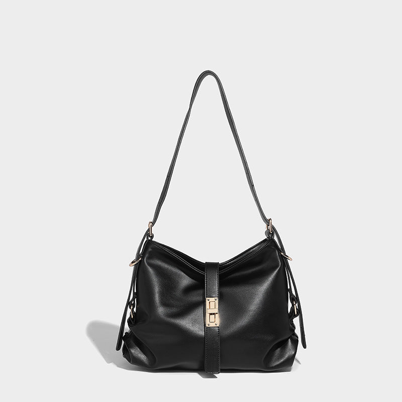 Soft slouchy hobo shoulder bag with smooth leather-look finish, gold-tone buckle and tab hardware, and long adjustable strap